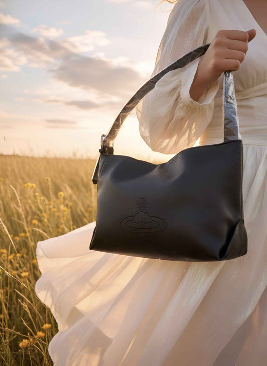 Cosmic Chic: Orb-Embossed Black Shoulder Bag 🪐